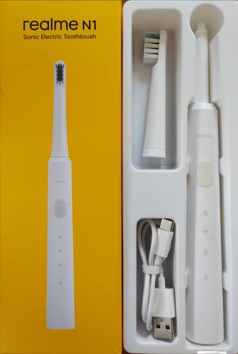 Электрическая зубная щетка 