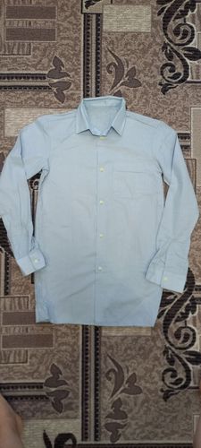 Новая рубашка светло-голубого цвета 158-164 