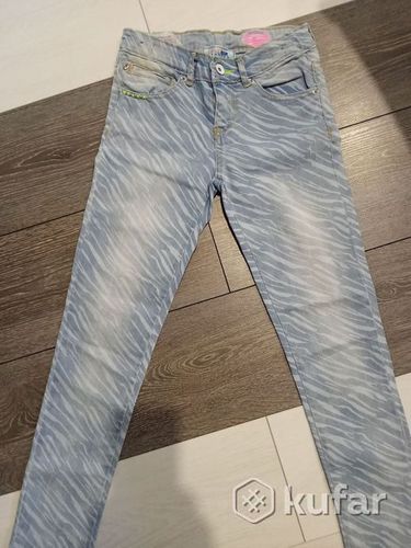 Фирменные стильные джинсы для красотки 